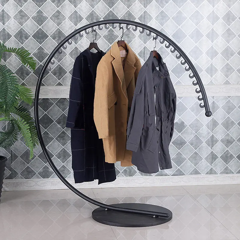 Curved metal clothing display arc with laser-cut hooks